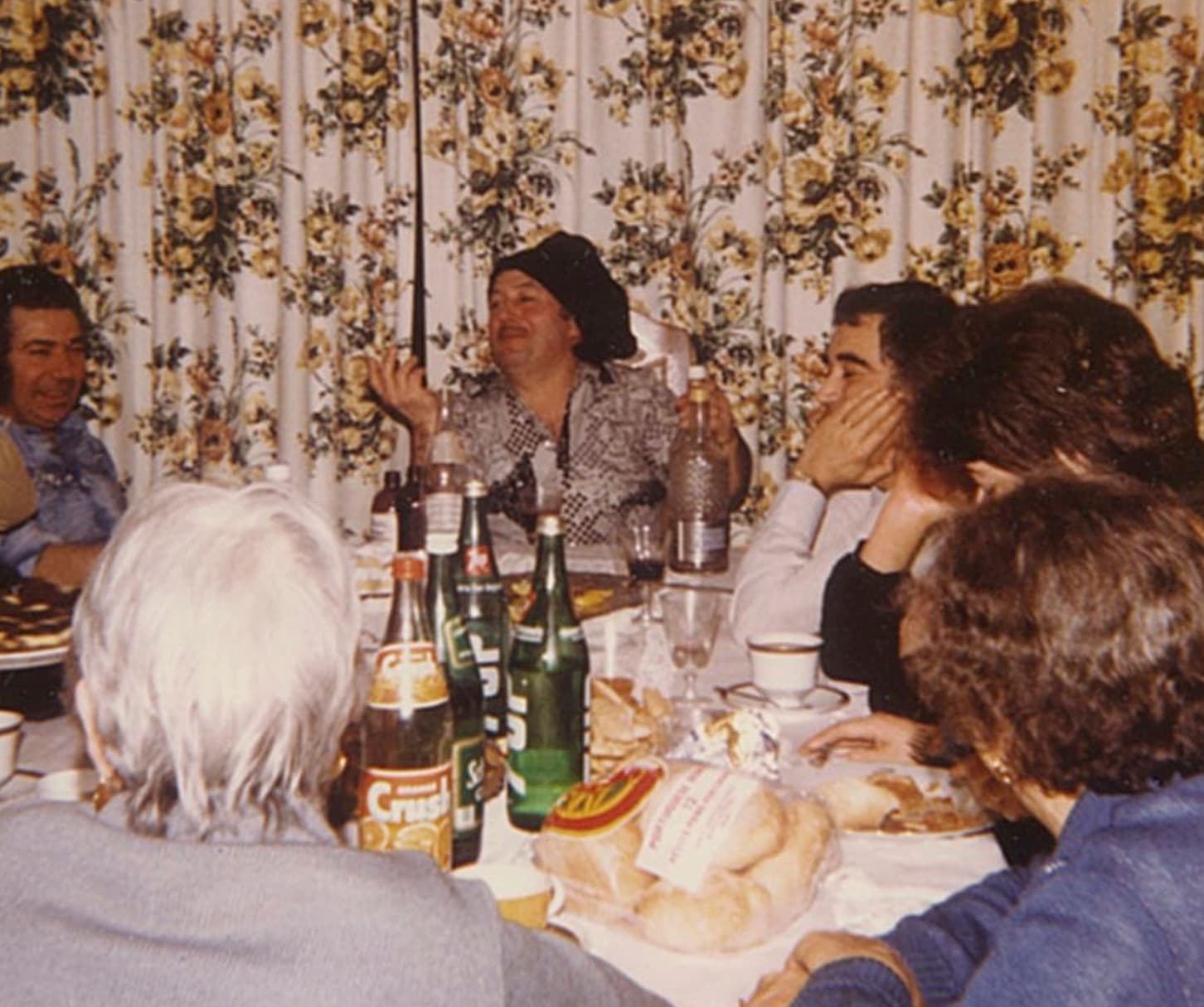 Friends sharing a long lunch around a table